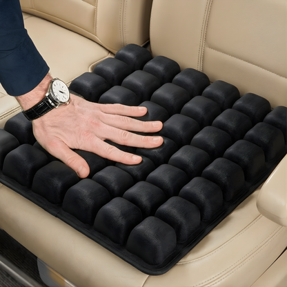 OCEVA seat cushion on car seat showing pressure relief as hand presses into ergonomic air cell design